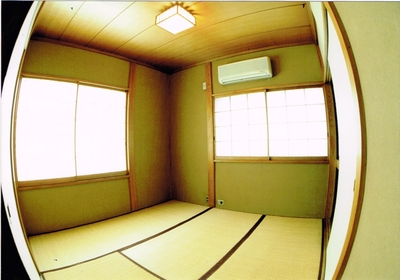 Japanese-style room: tatami floor, two shoji windows.