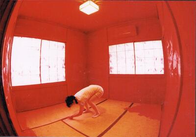 The tatami floor begins to turn red. The body is on all fours.