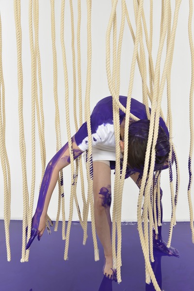Forward bending pose. Paint on the back rubs against the rope.