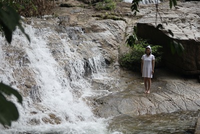 Verticality of the waterfall and the standing figure