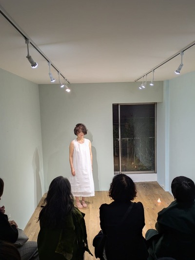 Standing figure, flames and audience