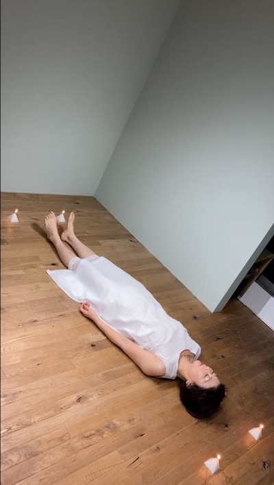 Lie down in a rectangle made of candles