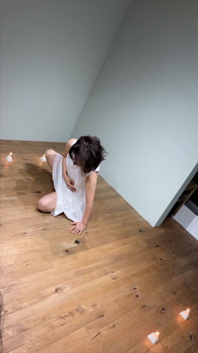 Crouched pose to the left of the candle rectangle