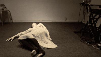 Ihoda, in a classical dress, begins moving from the floor