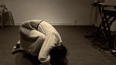 Again, the head touches the floor; hips lift into a rounded shape