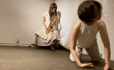 In front of Koketsu playing saxophone, Ihoda comes onto all fours