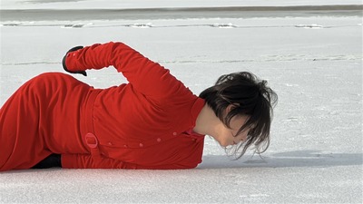 Soft sunlight; the pressed ice surface slowly begins to melt